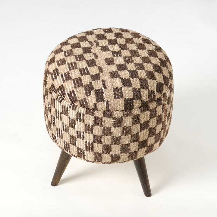 Checkered patterned stool with wooden legs on a white background