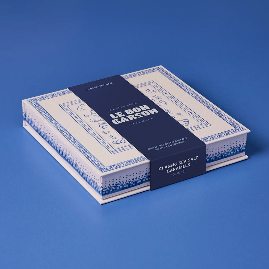 Box of Le Bon Carreé classic sea salt caramels on a blue background