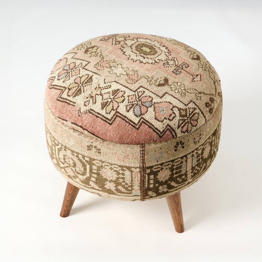 Round ottoman with patterned fabric cover on a white background. Vintage Rug Medium Ottoman 0735-K.