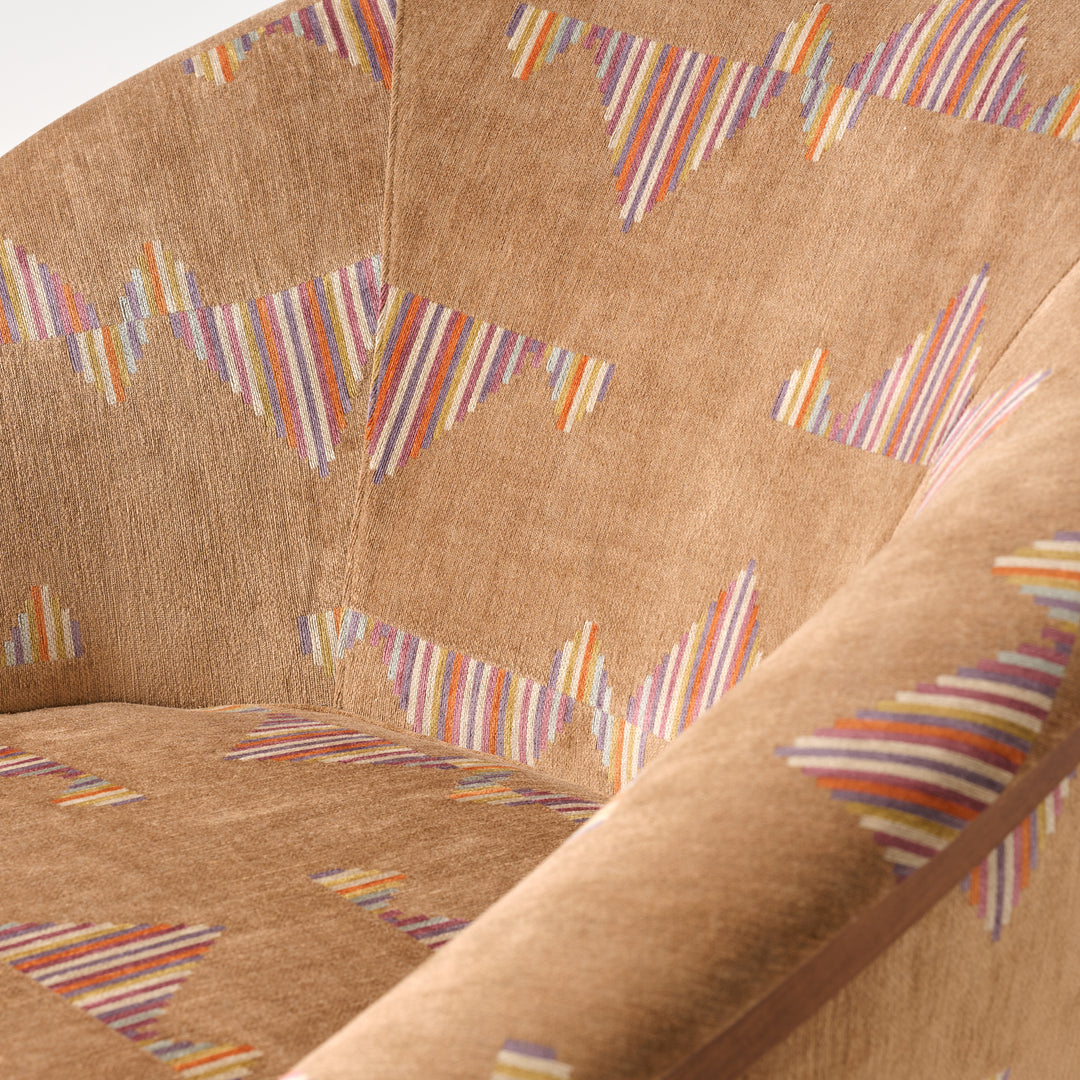 Close-up of a brown fabric with colorful striped patterns