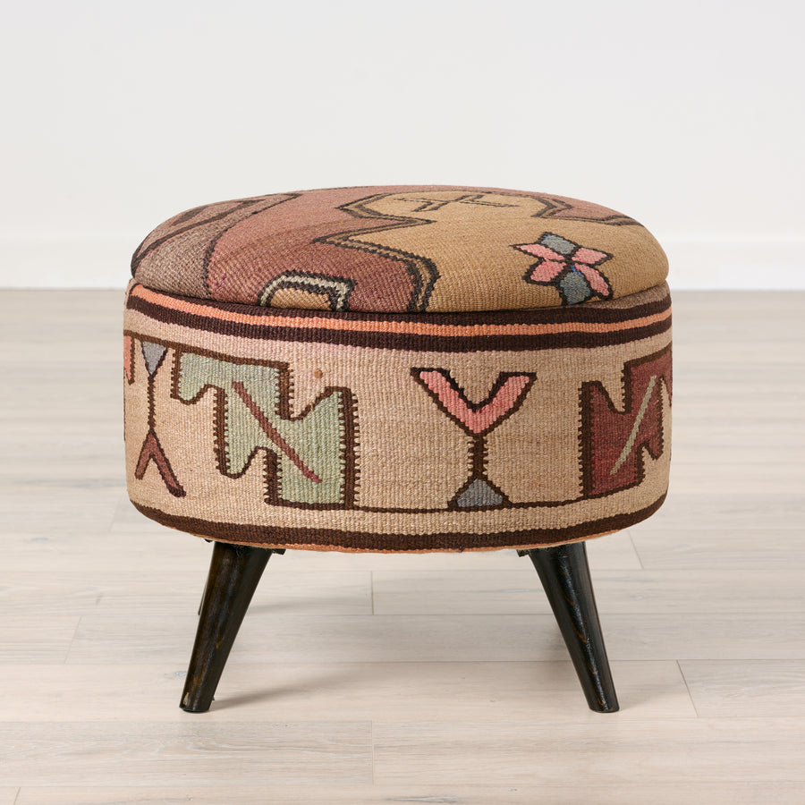 Decorative ottoman with geometric pattern on a light wooden floor. Vintage Rug Medium Ottoman 0735-L. 