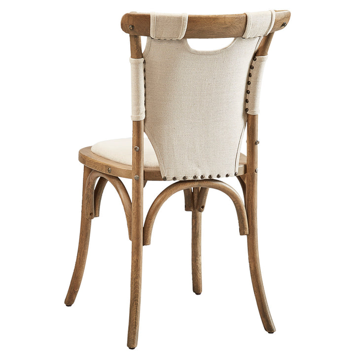 Wooden chair with beige cushioned backrest and seat on a white background