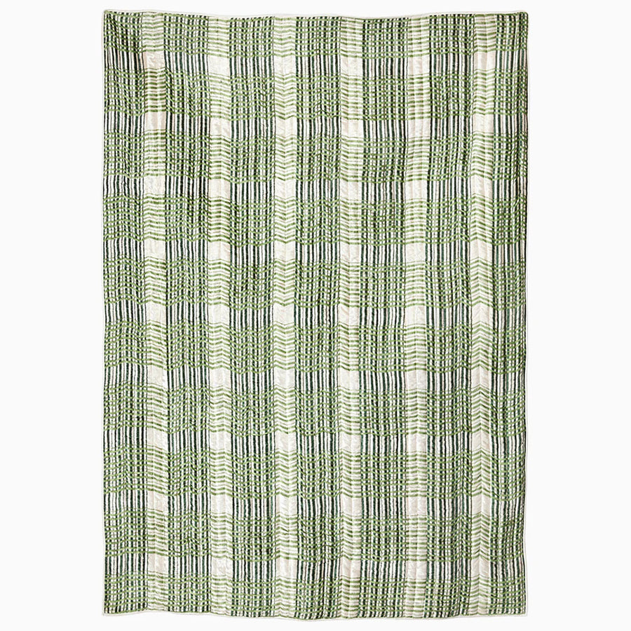 Textile with green and black striped pattern blanket on a white background