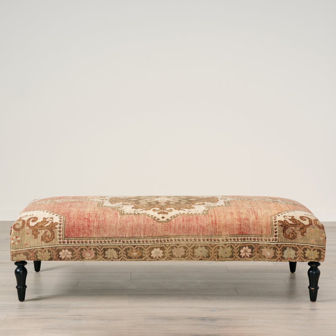 Decorative bench with intricate patterns on a plain background