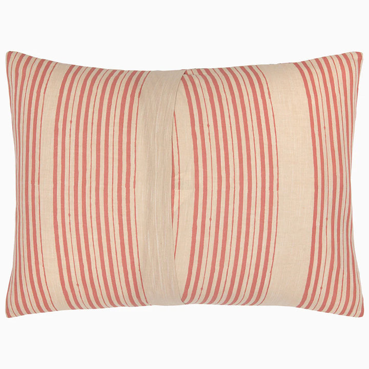 Striped pillow with red and beige pattern on a white background