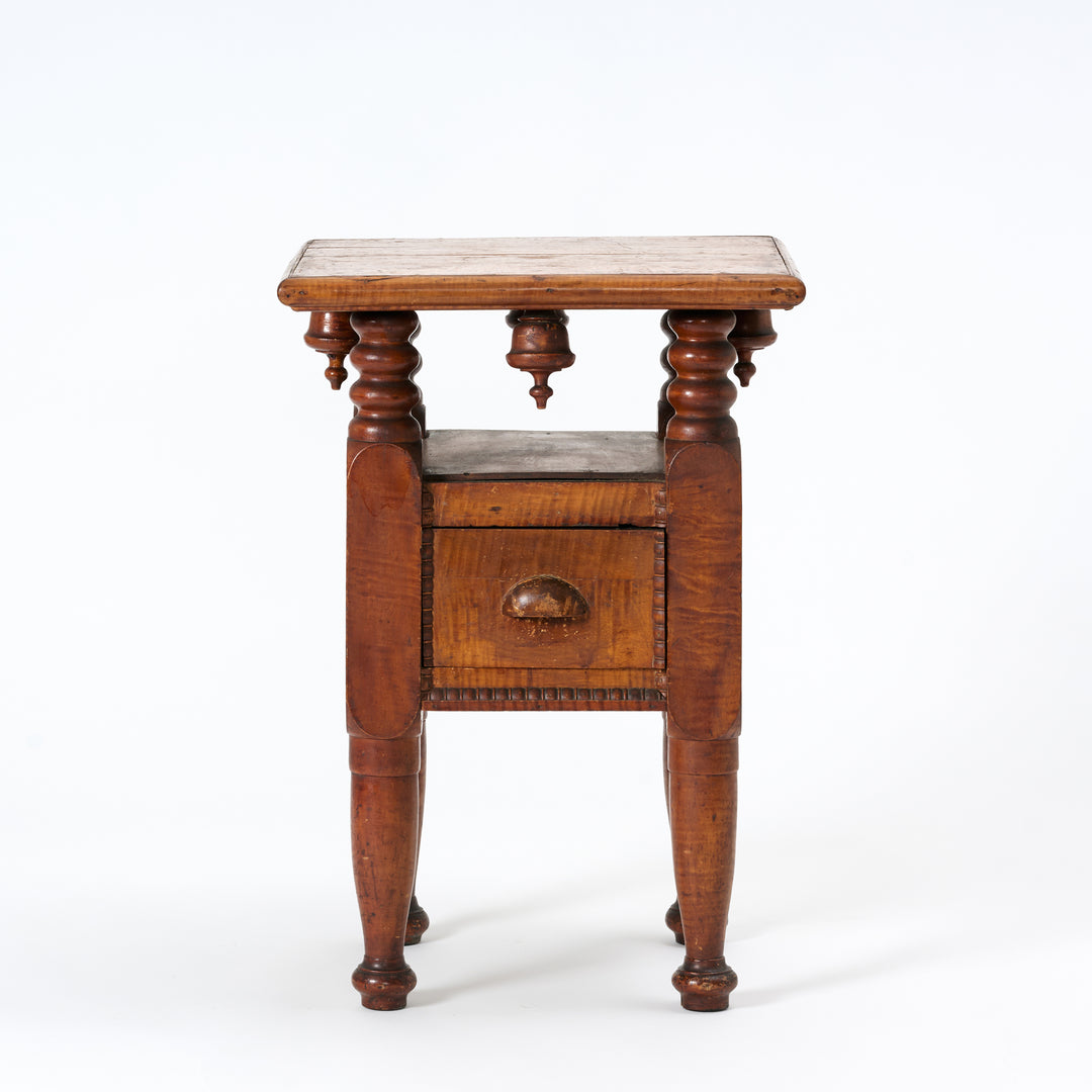 Wooden side table with wooden top on a white background