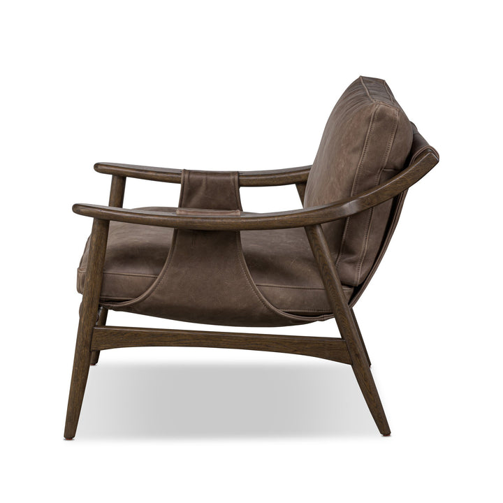 Brown leather armchair on a white background