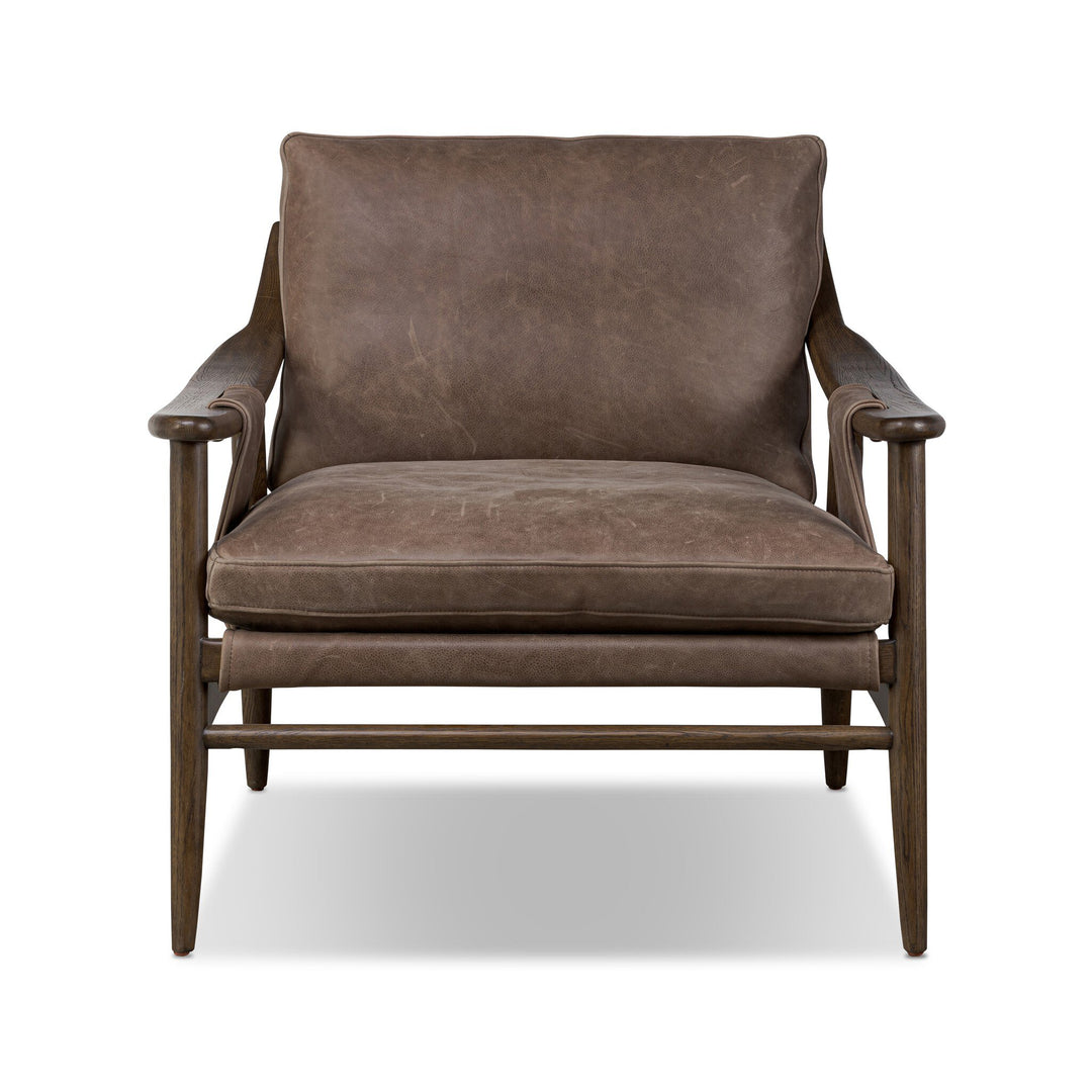Brown leather armchair on a white background