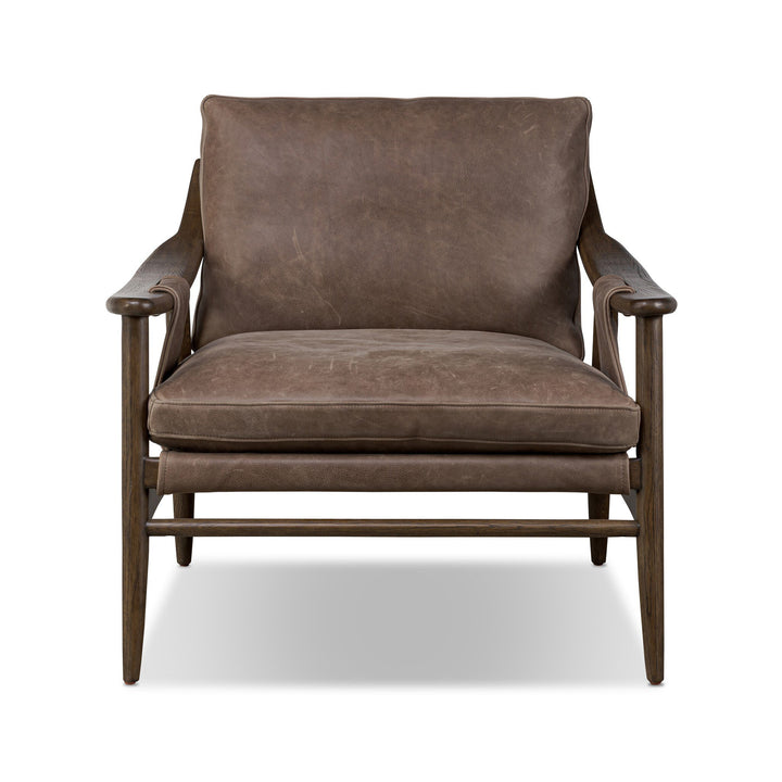Brown leather armchair on a white background