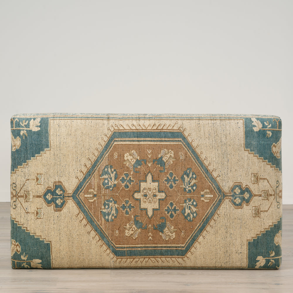 Decorative rectangular pillow with geometric pattern on a plain background