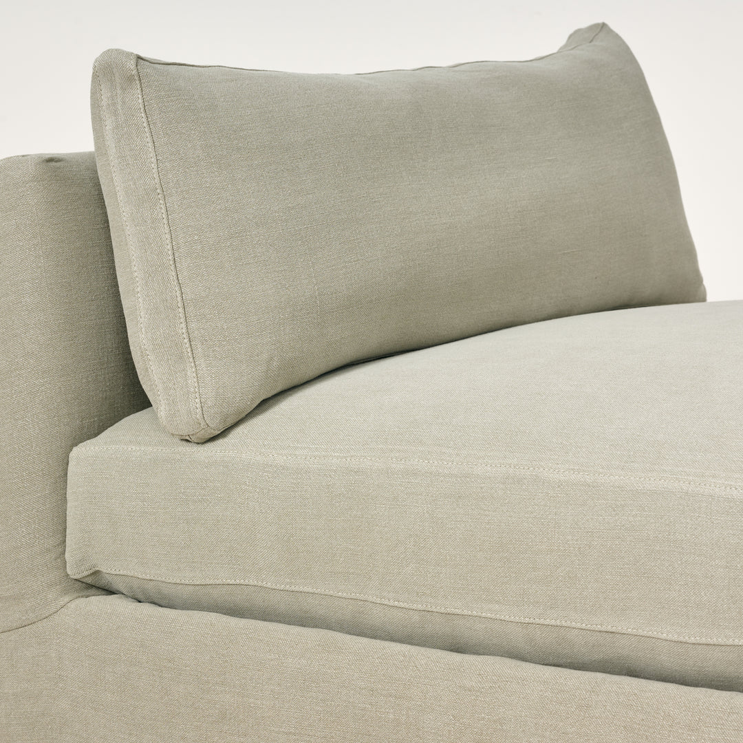 Beige sofa with a pillow on a white background