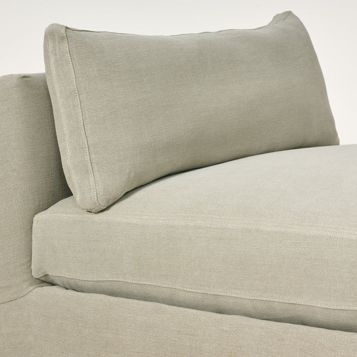 Beige sofa with a pillow on a white background