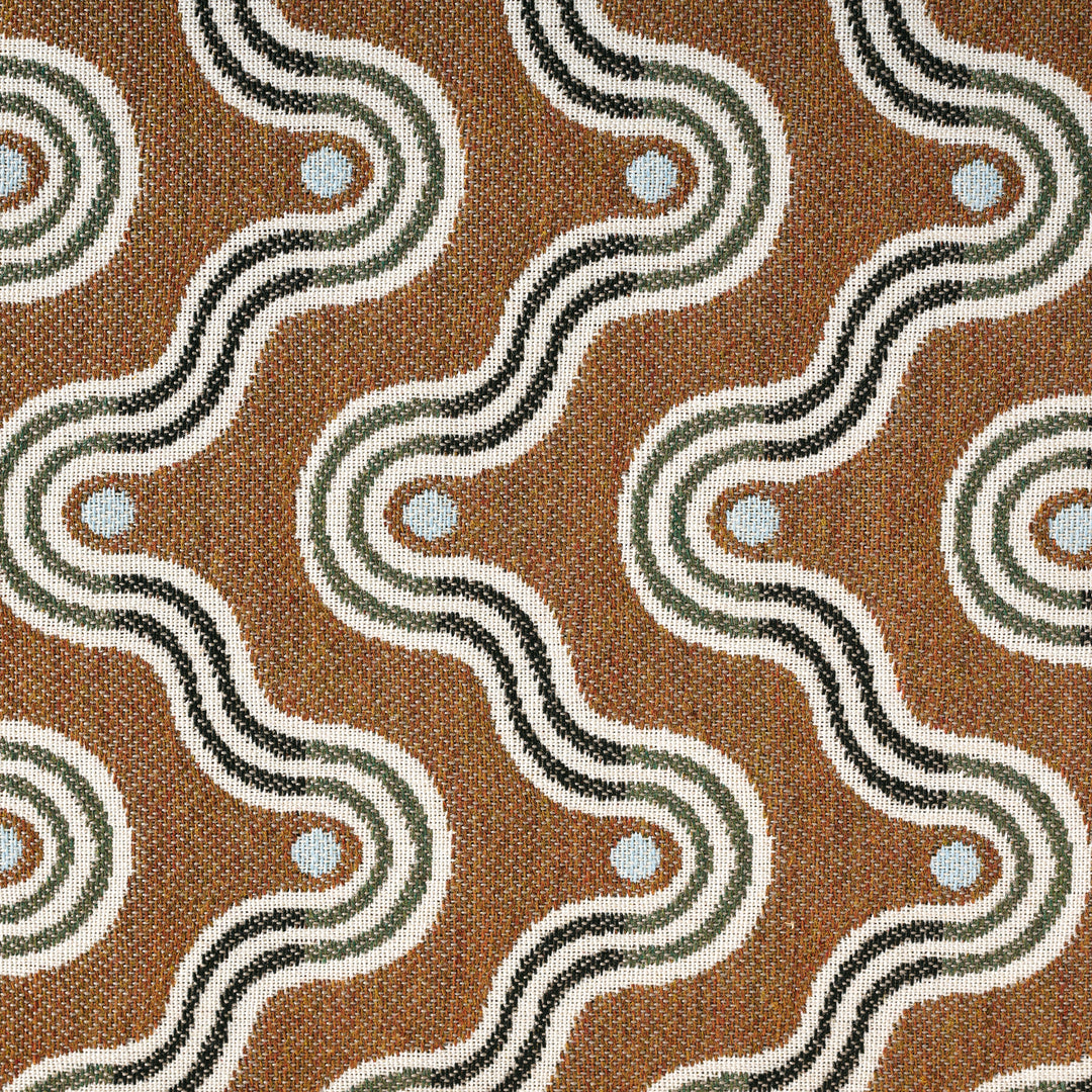 Patterned fabric with wavy lines and circular elements on a brown background