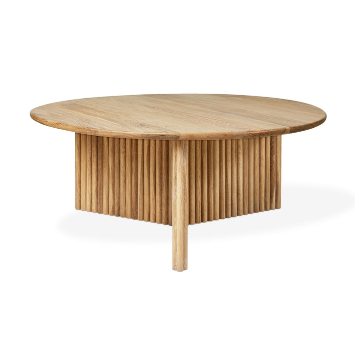 Wooden table with a unique base design on a white background