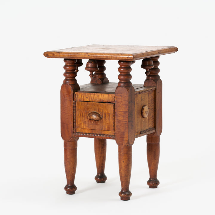 Wooden side table with wooden top on a white background