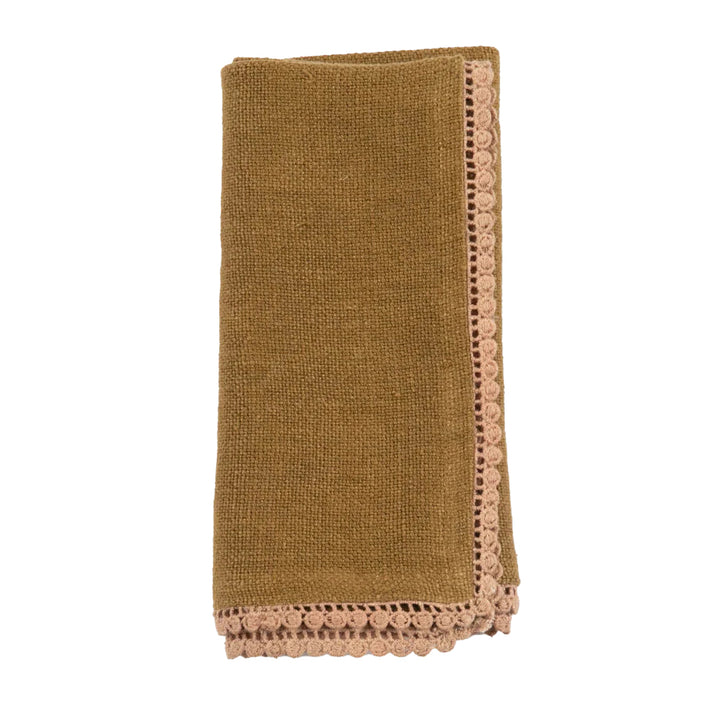 Brown textured napkin with lace trim on a white background
