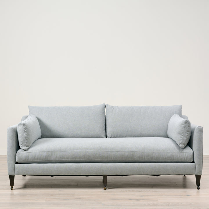 Holloway 90" Sofa  Upholstered in Kidproof Ice Blue with Tapered Leg in Chocolate Finish and Brass Caster with Cloud Down Standard Cushion