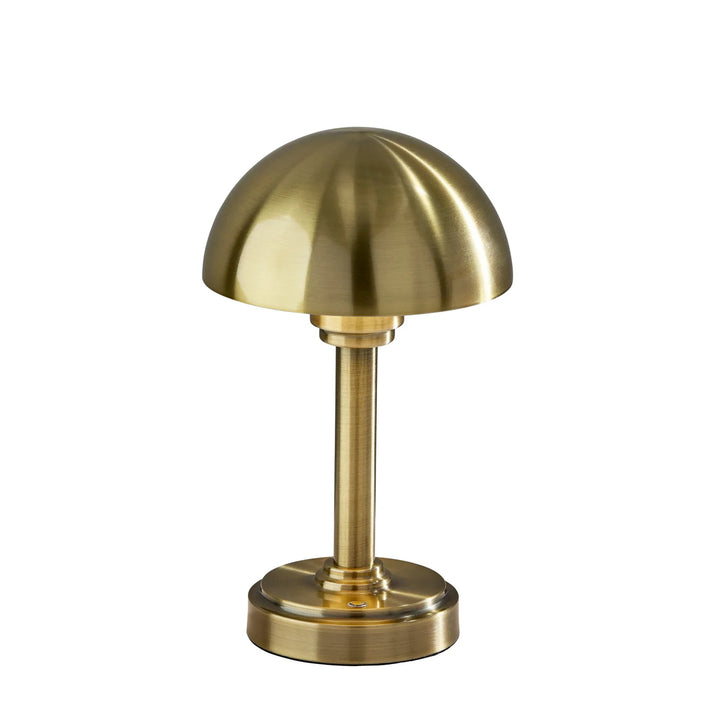 Gold-colored mushroom-shaped lamp on a white background