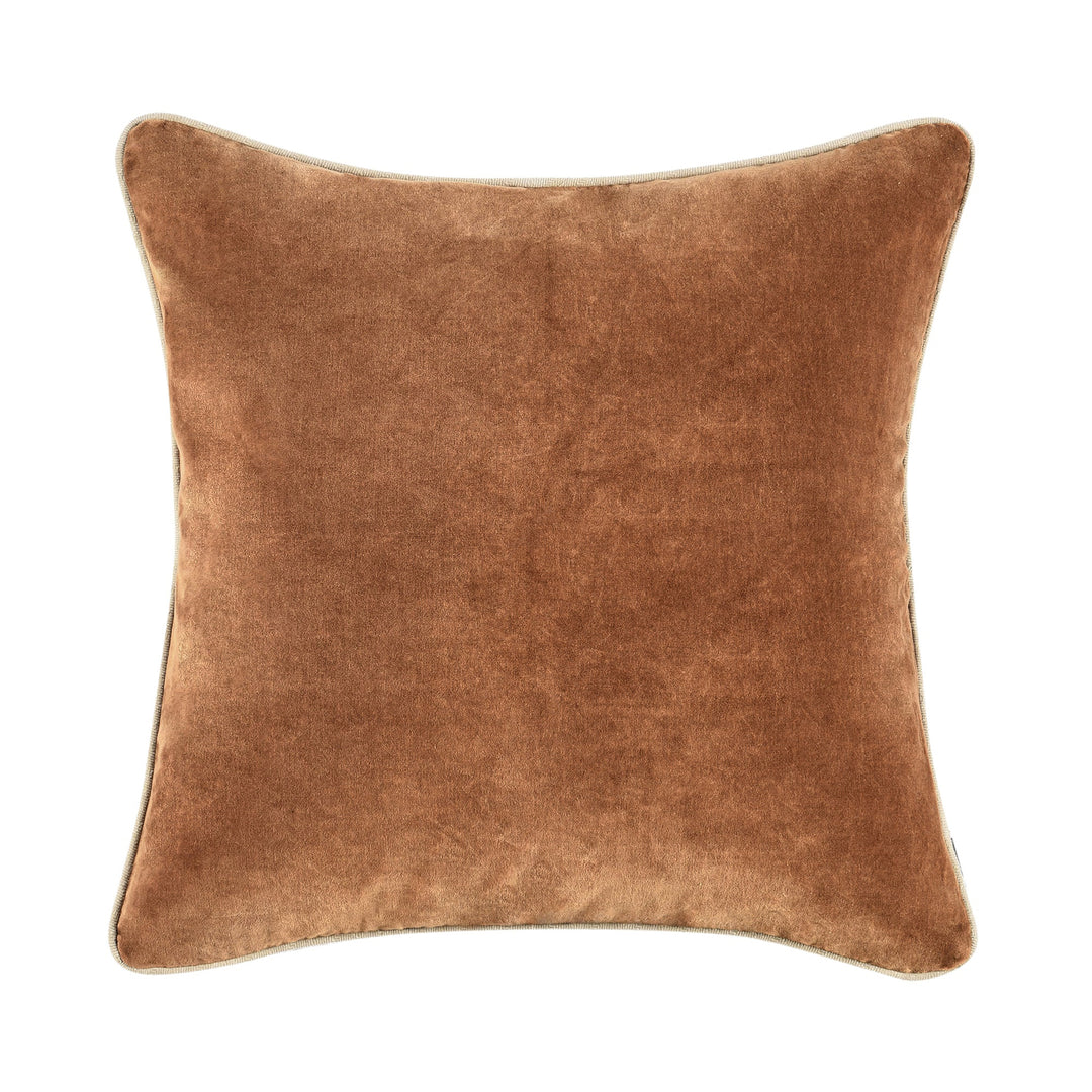 Brown velvet pillow on a white background