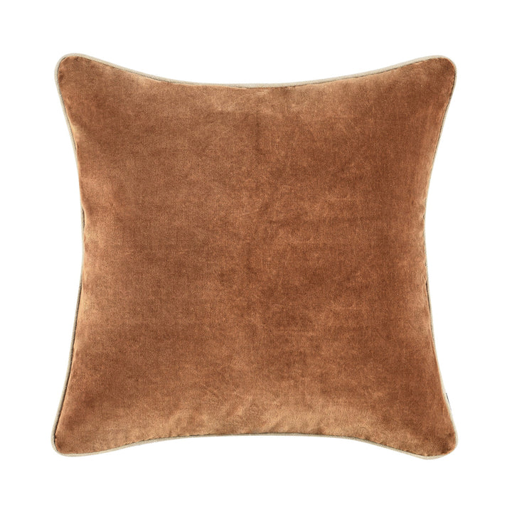 Brown velvet pillow on a white background