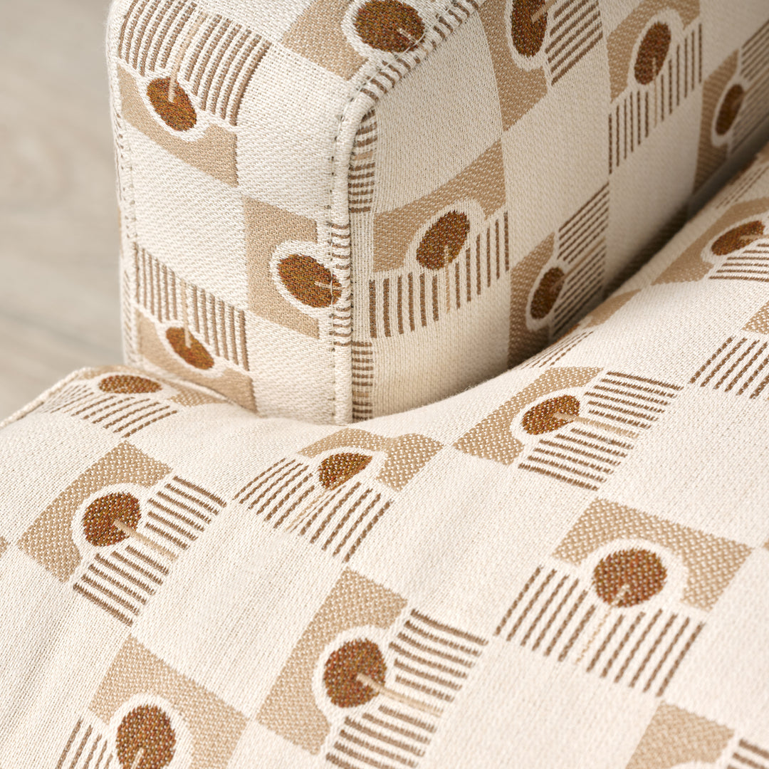 Close-up of beige fabric with brown geometric pattern
