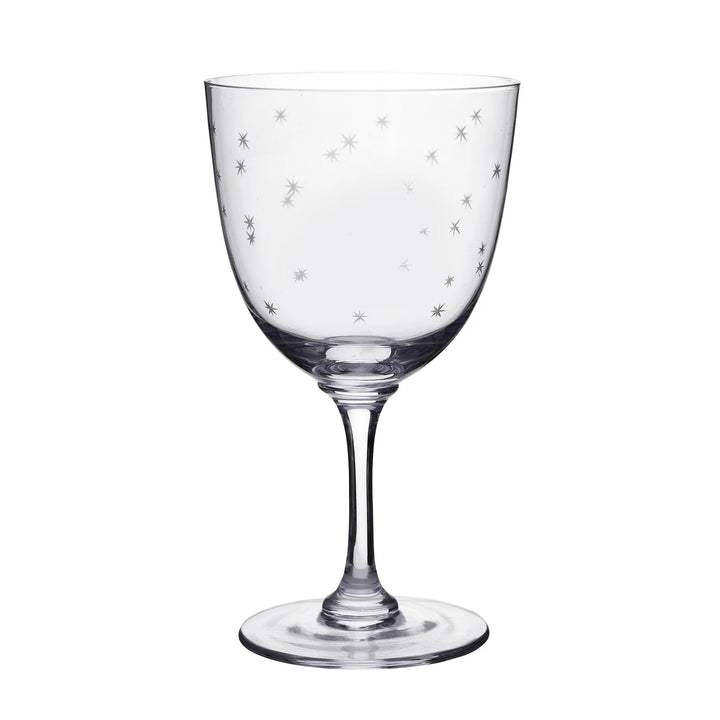 Clear glass wine glass with star patterns on a white background