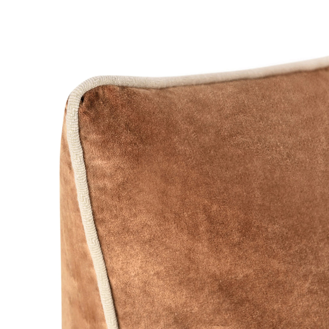 Close-up of a brown textured pillow with a white border on a white background