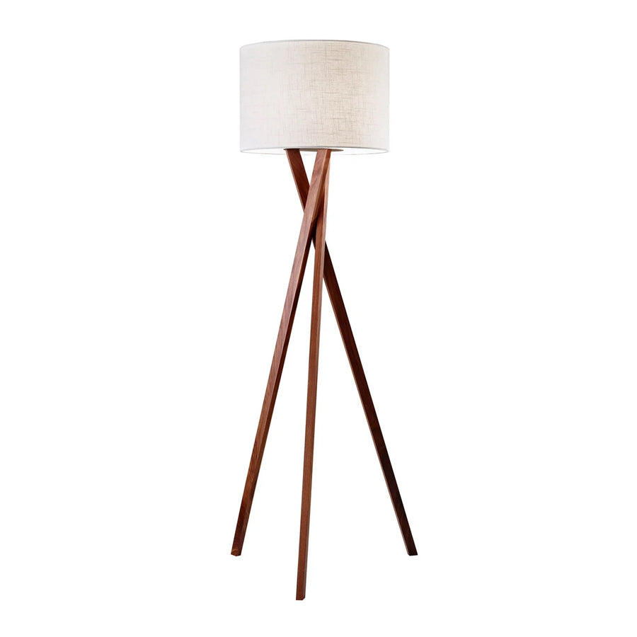 Wooden floor lamp with a white shade on a white background