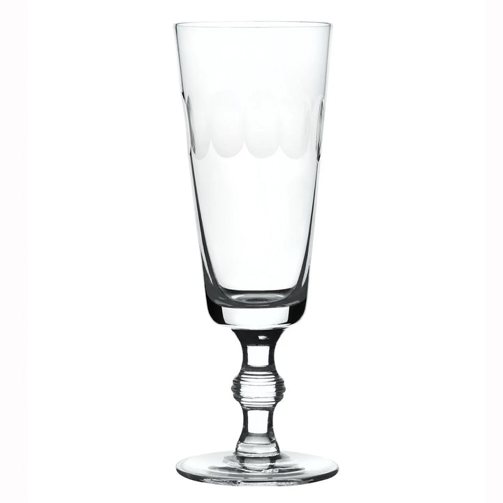Clear glass with a decorative base on a white background