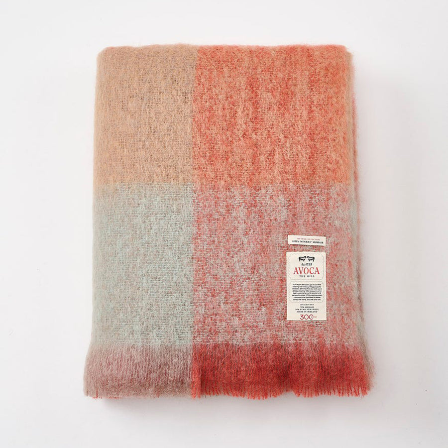 Plaid blanket with a label on a white background