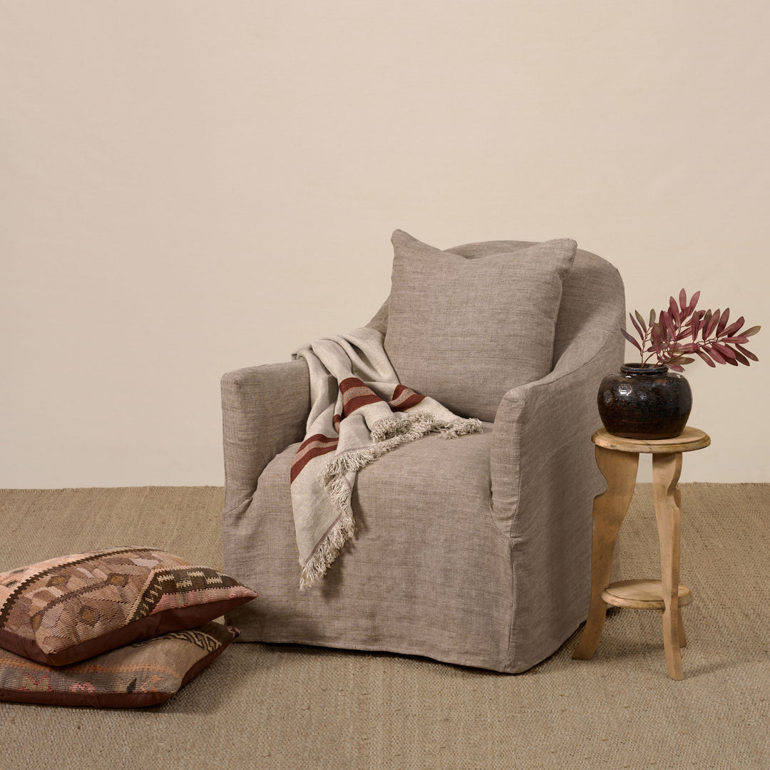 Noel Swivel Chair Slipcovered in Washable Clay Buff