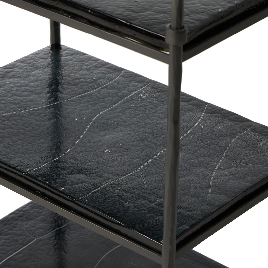 Black metal shelf with textured black glass shelves on a white background