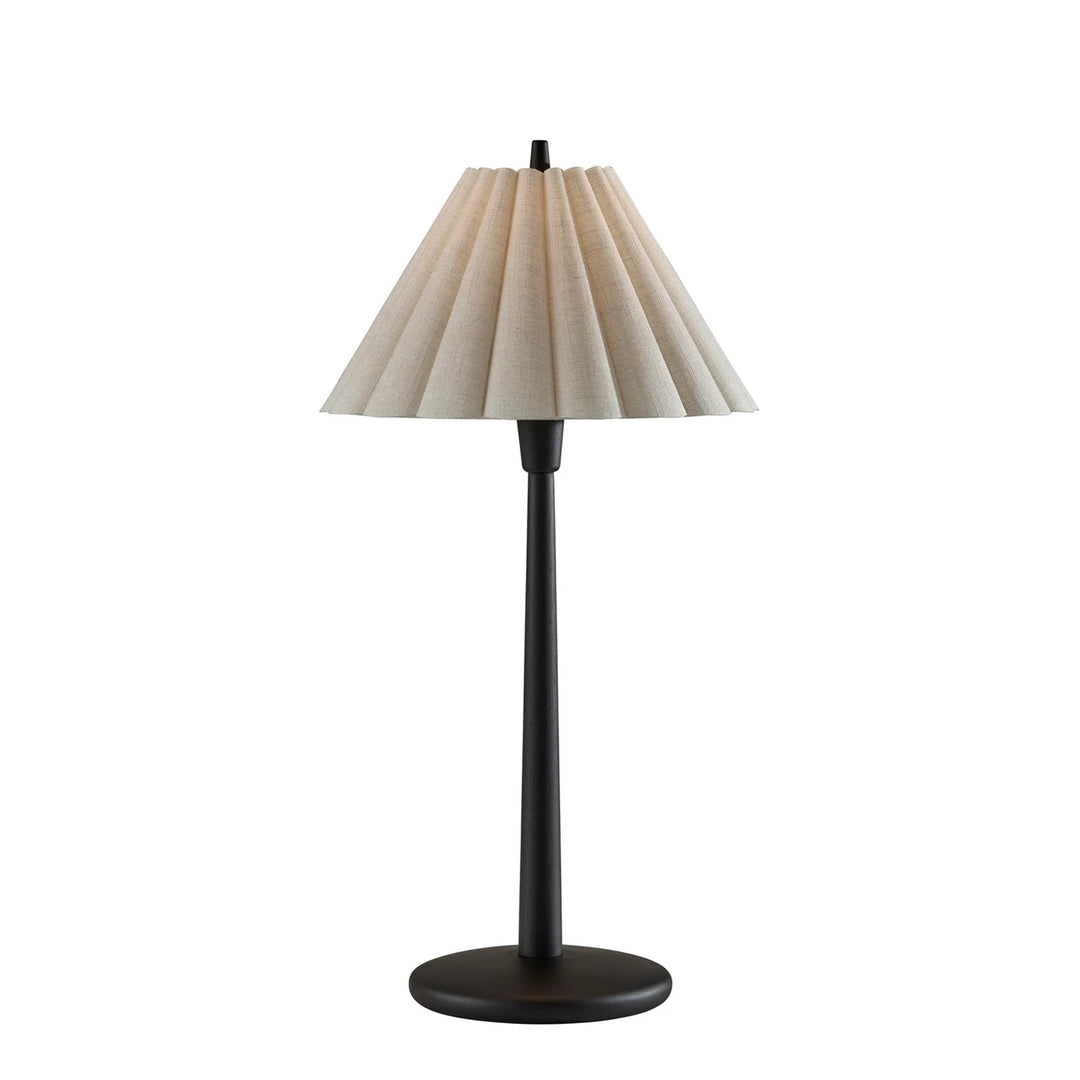 Table lamp with a pleated beige shade on a white background