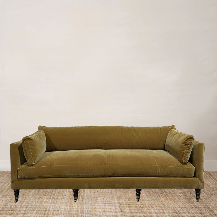 Madeilne 90” Sofa Upholstered in Harvest Brass with Cloud Down Blend Cushions and Chocolate Finish Brass Casters