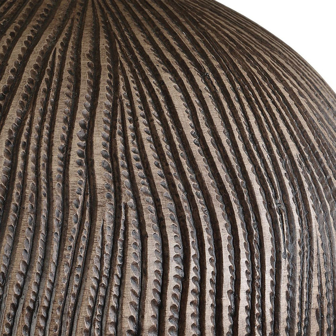 Close-up of a textured sphere with concentric circular patterns