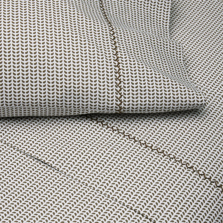 Textured fabric with a subtle pattern and visible stitching