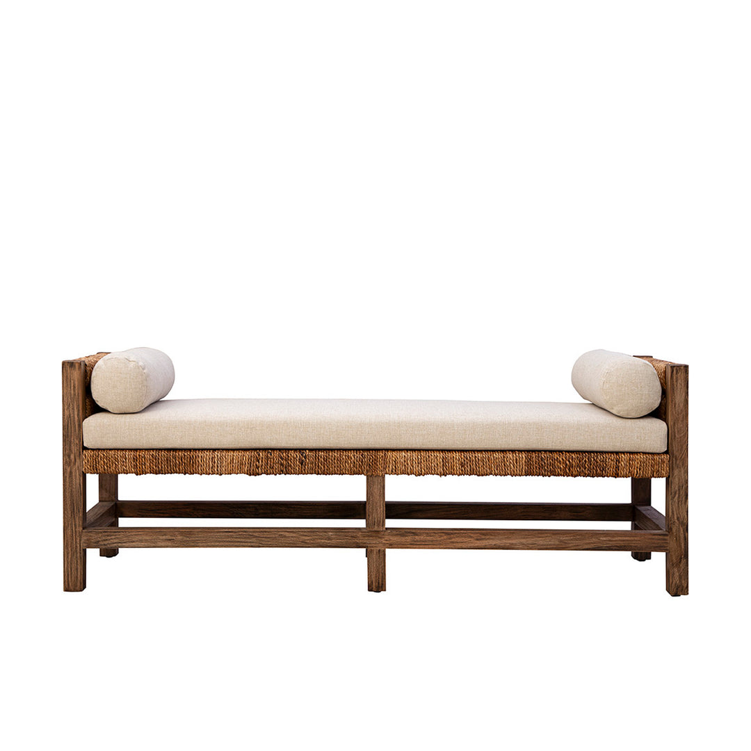 Wooden bench with beige cushion and spherical cushions on a white background