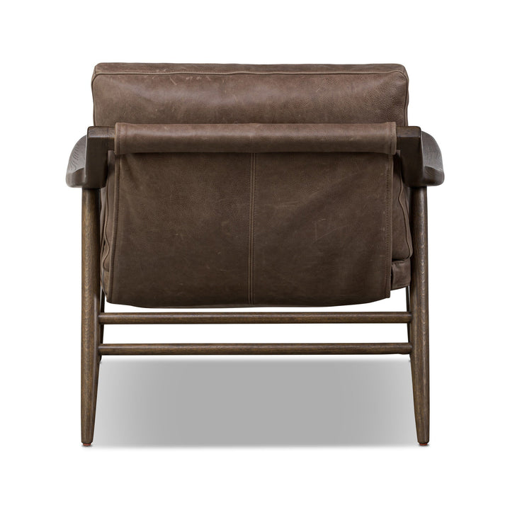 Brown leather armchair on a white background