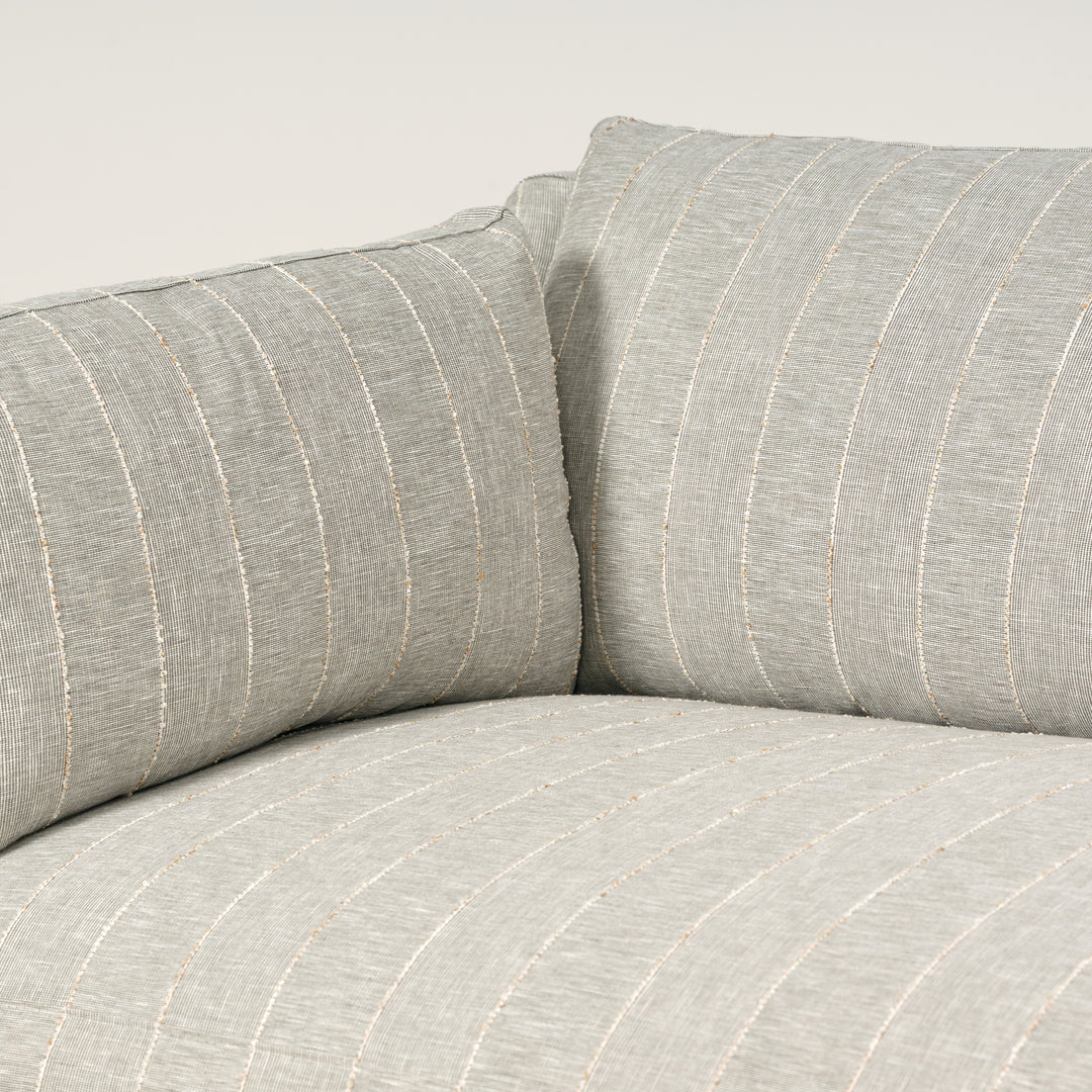 Gray striped sofa with a neutral background