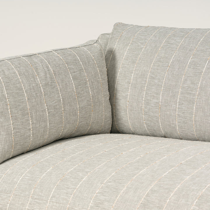 Gray striped sofa with a neutral background